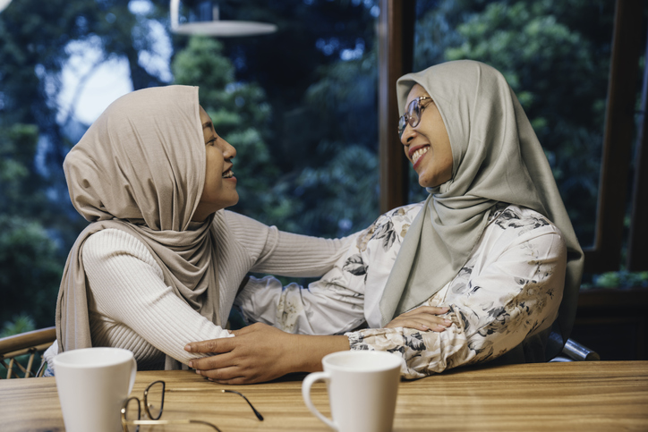 Image showing Muslim mother and daughter hugging